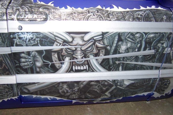 Bio mech mural on mazda pickup