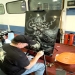Mike Lavalle airbrushes panel